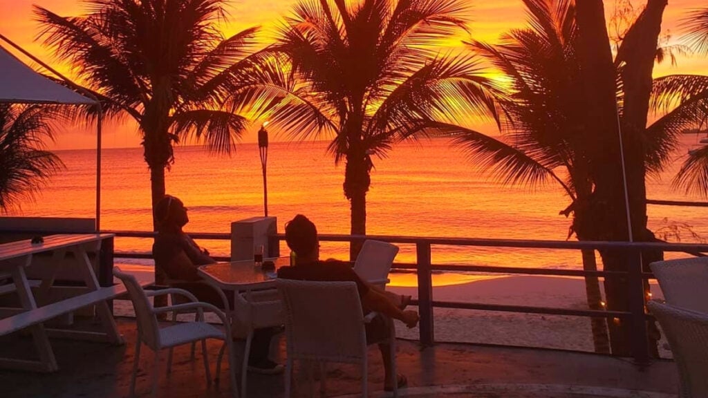 beautiful sunset on the patio of the bar beautiful sunset on the patio of the beach bar in barbados