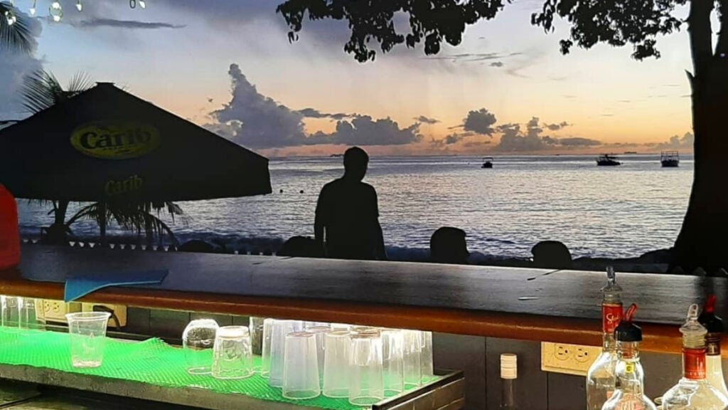Behind the bar at sunset Behind the beach bar at sunset in barbados