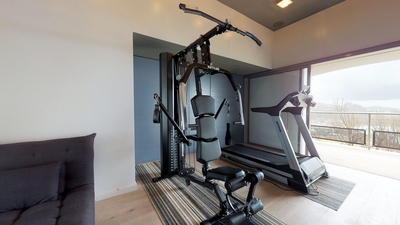 Fitness Room: Located on the lower level. Air-conditioned room with treadmill, weight bench and vari