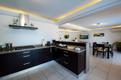 Kitchen & Dining Area: Fully equipped air-conditioned kitchen with electric oven, induction cooker, 