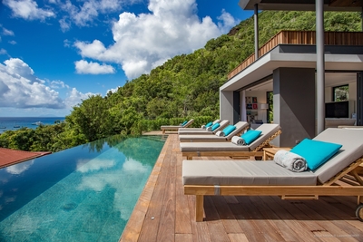 Terrace & Pool: Heated infinity pool (36 m x 12 m) with steps surrounded by a deck terrace. 