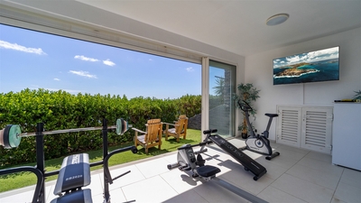 Fitness Room: Fully equipped and air-conditioned fitness room located on the lower level. 