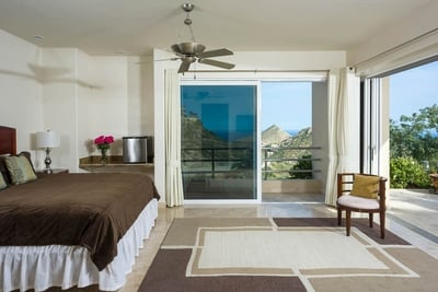 Wide sliding glass doors and windows bring in plenty of warm Cabo sun to brighten and open up the ro