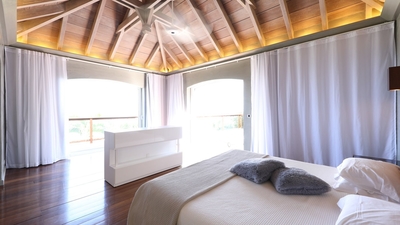 Master Bedroom 1: Located on the ground floor with access to the outdoor terrace overlooking the oce