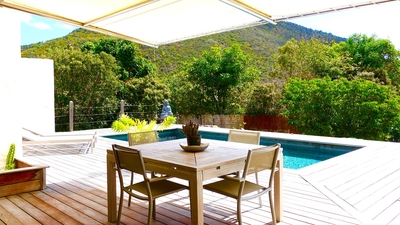 Outdoor Dining Areas: Outdoor dining table on the covered terrace, and at the back of the property.&