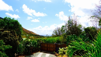 Outdoors: Beautiful garden surrounding the property. Private parking at the entrance. 