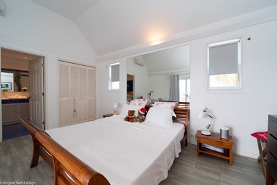 Master Bedroom: Located just past the living room. Opens onto the terrace and pool with ocean views.