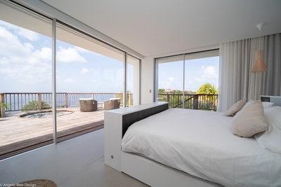 Bedroom 5: Master bedroom located on the lower level, under the pool, deck with jacuzzi and ocean vi