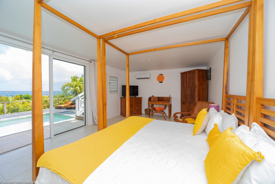 Habitation Saint Louis | Bedroom 2 with convertible king bed, ocean view, HDTV, air conditioning and