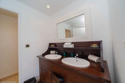 Habitation Saint Louis | Bedroom 2 en-suite bath with shower, double vanity and hair dryer.