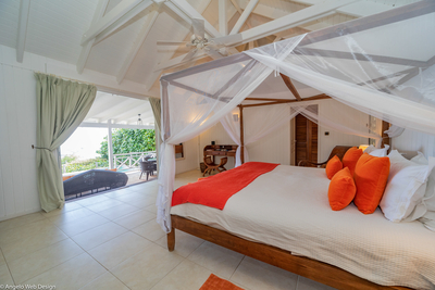 Petit Saint Louis | Bedroom 5 with ocean view, HDTV, dressing room and safe.