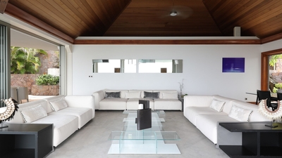 Living Area: In a separate bungalow opening to the pool deck - rattan couches with black fabric and 