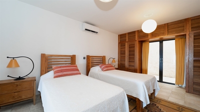 Bedroom 1: Located on the main level. Air conditioning, two twin beds (convertible into a king size 